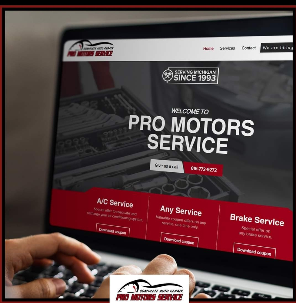 Laptop screen displaying the Pro Motors Service website homepage.