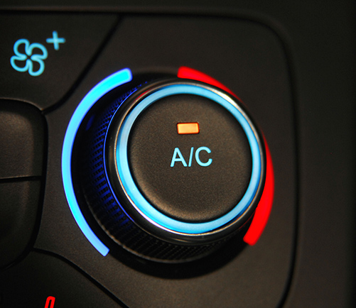 Why You Should Not Use Air Conditioning In A Can! Close-up of a car dashboard A/C control knob.